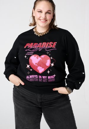 Sweat-shirt noir avec un graphisme coloré d'un cœur et d'un globe accompagné de texte. Manches longues avec de légers détails bouffants aux poignets. Tissu doux.