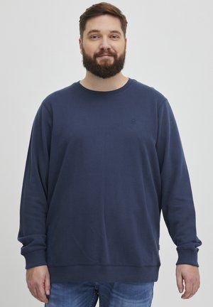 Navy blue sweatshirt with a crew neckline and long sleeves. Made of soft fabric, featuring a subtle logo on the chest and ribbed cuffs.