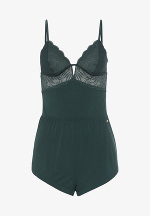 Romper verde scuro con scollatura in pizzo, spalline regolabili e vita aderente, che si trasforma in pantaloni corti larghi.