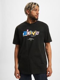 Black cotton t-shirt featuring a colorful "BKLYN" graphic on the front. Crew neckline and short sleeves. Relaxed fit, casual style.