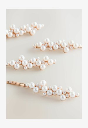 Set of four hair clips featuring a gold-tone base adorned with clusters of varying sizes of white pearls, creating a textured, organic shape.
