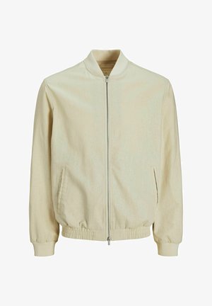 Giubbotto bomber color beige chiaro con colletto a costine, chiusura con zip, tasche laterali e polsini elastici. Tessuto resistente con una finitura leggermente strutturata.