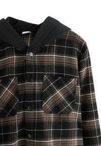 Brun og sort ternet skjorte med hætte i sort, der har to brystlommer og trykknapper. Stoffet har en blød tekstur.