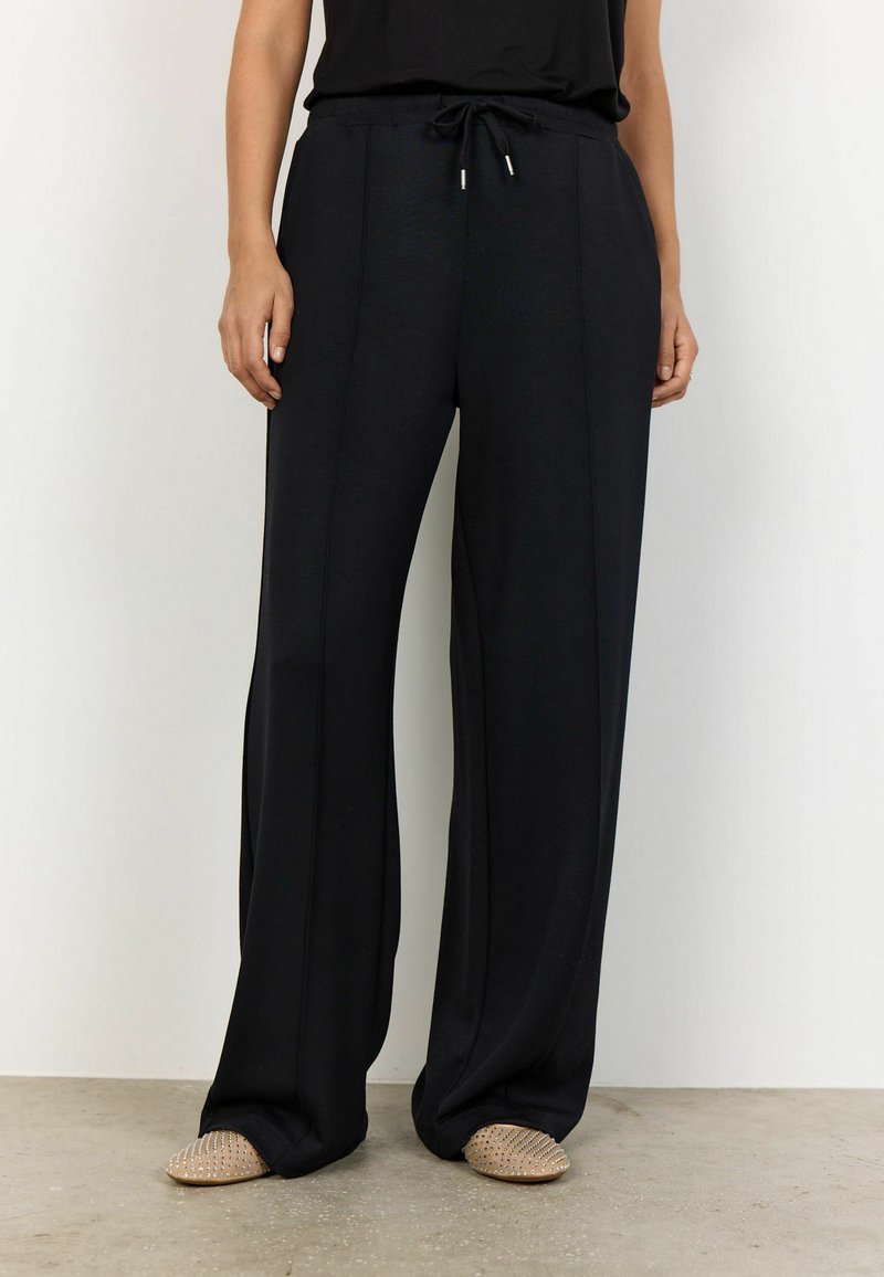 Black wide-leg pants with an elasticated drawstring waist, featuring subtle vertical seams and soft, smooth fabric texture.