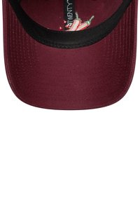 Maroon baseball cap with black inner trim and embroidered label featuring two chili peppers and text inside the brim.