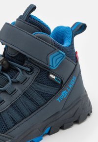Blue and gray hiking boots with mesh and synthetic material, featuring a Velcro strap, textured sole, and AquaProof branding.