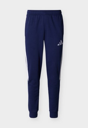Pantalones deportivos jogging azul marino con cintura elástica, franjas blancas en los lados, tobillos ajustados y pequeño logo blanco en la parte superior del muslo.
