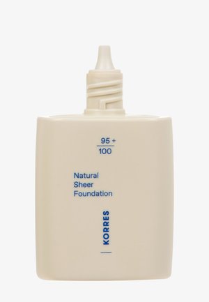 Beige rectangular bottle with a pointed cap labeled "95+ / 100 Natural Sheer Foundation" and brand name "KORRES" in blue text.