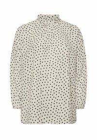 Blusa crema con pois neri, colletto alto, maniche lunghe e dettaglio plissettato sullo scollo. Tessuto liscio e leggero.