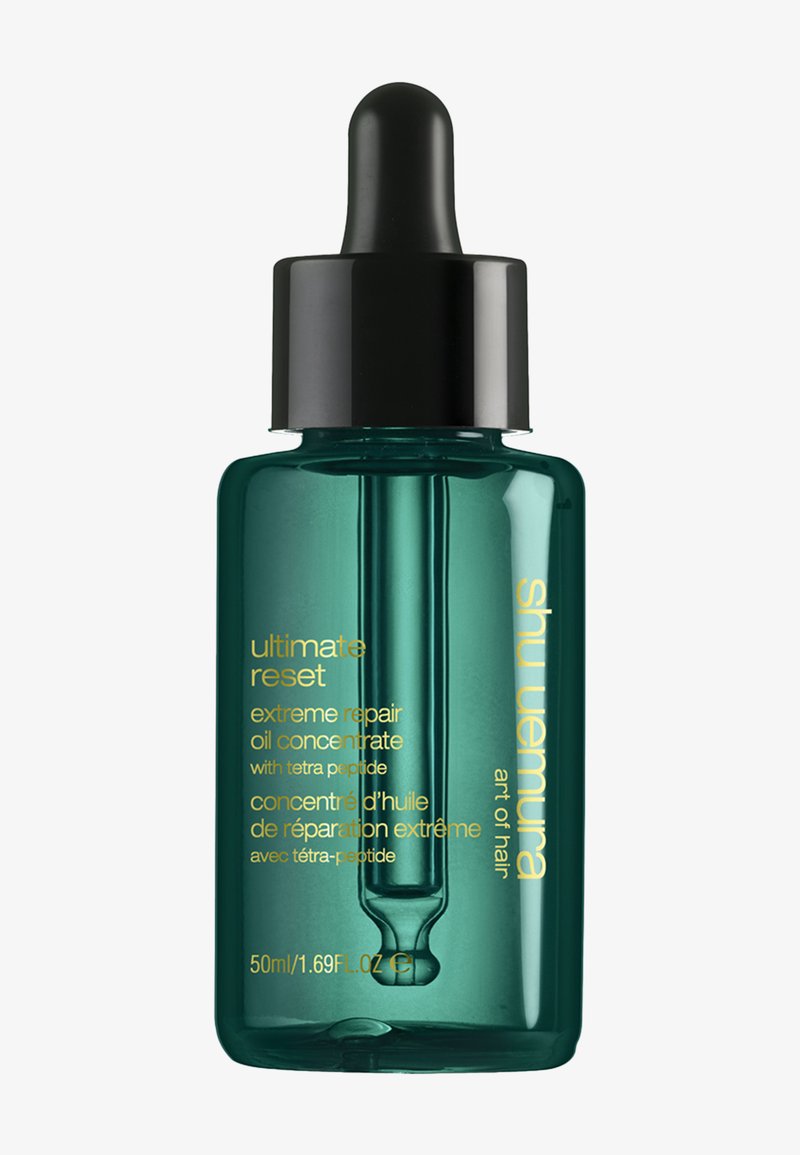 Flacon compte-gouttes en verre vert de Shu Uemura Ultimate Reset concentré d'huile réparatrice extrême, 50 ml, avec bouchon noir et texte doré.