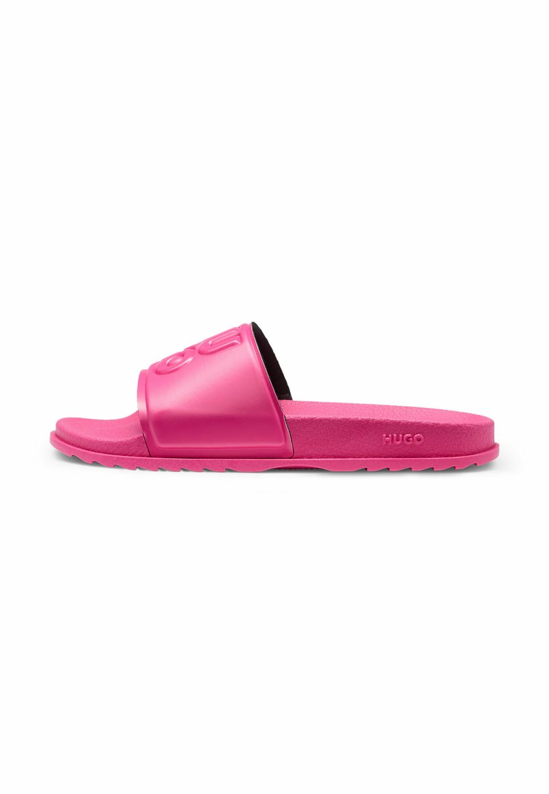Pink slide sandals with a wide strap featuring embossed logo, flat textured sole, and durable material. Grey traction on the underside.