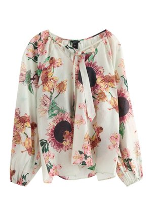Bloes met bloemenmotief van lichtgewicht stof, lange mouwen, een geraffineerde halslijn en een reeks zonnebloemen met roze accenten op een crèmekleurige achtergrond.