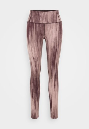 High-waisted leggings in muted pink with abstract dark brown streaks, featuring a smooth texture and fitted shape.