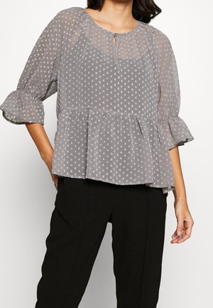 Graue transparente Bluse mit einem gepunkteten Muster, rundem Ausschnitt, Schlüssellochdetail und ausgestellten Ärmeln. Peplum-Stil mit weichem, fließendem Material.