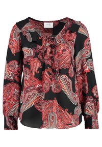 Svart blus med röd och vit paisleymönstring. Har en knytning fram, volangkrage och samlade ärmslut för en mjuk textur och flöde.