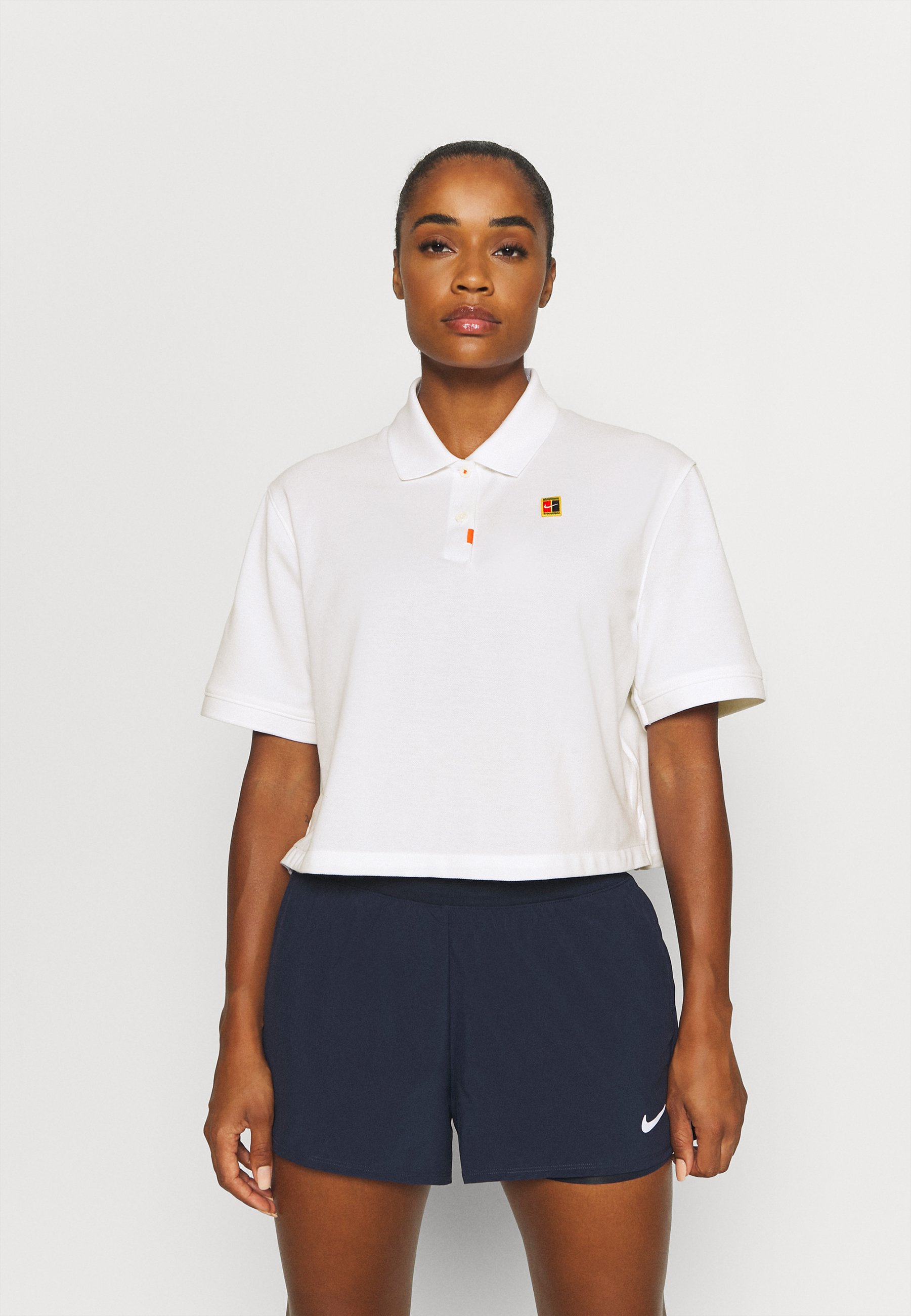 Nike Performance THE 2.0 HERITAGE - Polo shirt - white/brilliant  ornge/white - Zalando.co.uk