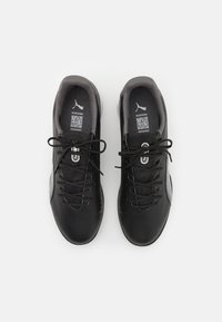 Black athletic shoes with gray accents, smooth synthetic leather upper, round toe, and lace-up closure. Padded collar and tongue.