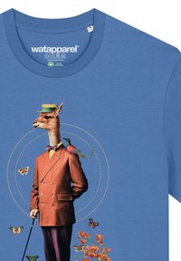 Blue cotton t-shirt with a whimsical printed design of a giraffe in a brown suit, bowtie, green hat, floral and butterfly accents.