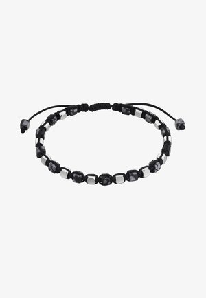 Bracelet en cordon noir avec perles carrées noires et argentées alternées, fermoir à nœud coulissant réglable avec extrémités perlées.