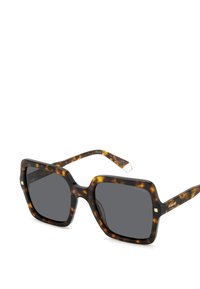 Occhiali da sole tartarugati con montatura quadrata oversize, lenti scure e un accento dorato sulla tempia. Realizzati in materiale plastico.