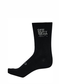 Svart bomullssocka med ribbat skaft och "OFF DUTY GEAR"-logotyp i ljusgrått. Har en klassisk crew-längd och en jämn textur.