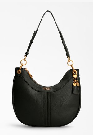 Czarna skórzana torebka na ramię ze złotymi elementami, regulowanym paskiem, zamknięciem na zamek oraz małymi przypinkami z logo zawieszonymi z boku.