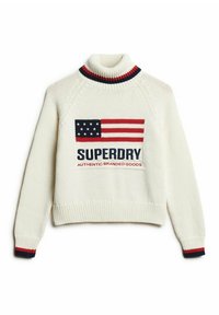Maglione lavorato a maglia di colore crema con collo alto, caratterizzato da una grafica della bandiera americana e la scritta "SUPERDRY", accentuato da strisce rosse e blu navy.