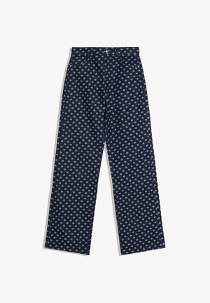 Jean droit bleu marine avec des pois gris clair, fermeture avant à boutons et zip, style cinq poches.