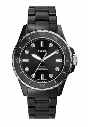 Black Fossil watch featuring a round face with silver accents, diamond-like markers, and a resin link band. Water-resistant to 100 meters.
