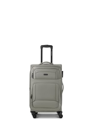Gray soft-shell suitcase with retractable handle, front zip pockets, and four spinner wheels standing upright on a white background.