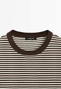 Close-up of brown and white horizontal striped crew neck shirt with ribbed collar and Massimo Dutti label.