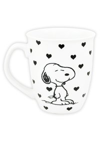 Tazza in ceramica bianca con un'illustrazione nera di un cane cartone circondato da piccoli cuori neri. La tazza ha un manico curvo.