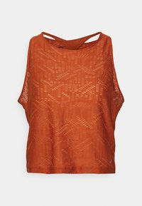 Débardeur couleur rouille à coupe décontractée, avec un motif texturé, des emmanchures larges et un design croisé dans le dos. Matière légère.