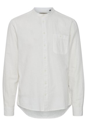 Balta garām piedurknēm kreklā, kas izgatavots no viegla auduma, ir mandarina apkakle, pogu aizdare un viena krūšu kabata. Mīksta tekstūra.