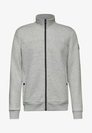 Szara bluza na zamek z teksturowanej tkaniny, z kołnierzykiem stojącym, czarnym zamkiem błyskawicznym oraz bocznymi kieszeniami z guzikowymi akcentami.