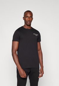 Björn Borg ESSENTIAL - Pamata T-krekls - black beauty