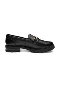 Black leather loafers feature a slip-on design, a prominent gold-toned buckle, and a chunky, ridged sole for added traction.