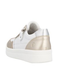 White sneaker with metallic gold accents, smooth leather and textured fabric, rounded shape, zipper closure, and a thick white outsole.