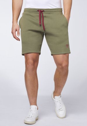 Olivegrüne sportliche Shorts mit einem Kordelzugbund, umgeschlagenen Säumen und gesticktem Logodetail am linken Oberschenkel. Aus weichem Baumwollmixmaterial.
