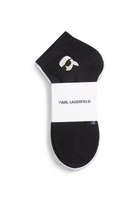 Calcetines cortos negros con un gráfico bordado de una cara con gafas de sol. Acompañados de una banda blanca etiquetada "KARL LAGERFELD".