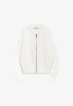 Witte rits-hoodie met een ronde kraag, verlaagde schouders en geribbelde manchetten, gemaakt van zachte stof met een gladde textuur.