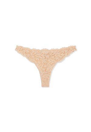 Tanga in pizzo color beige chiaro. Motivo floreale con bordi scallop. Tessuto morbido e trasparente. Design minimalista con spalline sottili.
