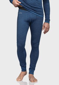 Therm blaue Leggings aus weichem, dehnbaren Stoff mit glatter Textur. Verfügt über einen elastischen Bund und eine enge Passform, die zu den Knöcheln hin tapert.