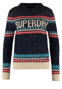 Neulepusero tummansinisestä langasta, jossa on monivärisiä kuvioita ja "SUPERDRY" -teksti rinnan kohdalla. Varren ja helman ribbireunat, pehmeä pinta.