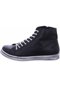 Black high-top sneaker made of leather, featuring white laces, a rubber sole with black and white stripes, and a side zipper for closure.
