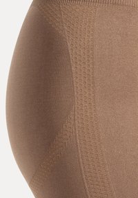 Beige Shapewear aus glattem, nahtlosem Stoff mit einem strukturierten Muster an der Seite. Der elastische Bund sorgt für eine bessere Passform und hohen Tragekomfort.