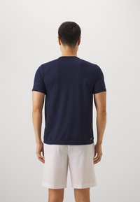 Lacoste Sport T-SHIRT TC - Sport T-shirt - white/navy blue