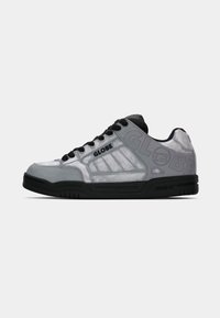 Low-top Globe sneaker in shiny gray with black laces, black sole, and "GLOBE" branding on the side and heel.