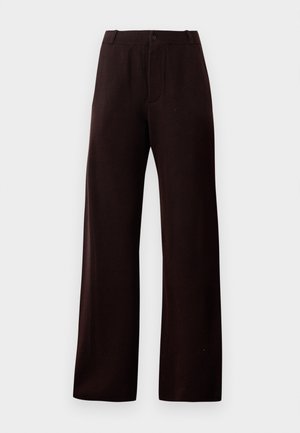 Tumši brūni platā kaki bikses ar rāvēju, pogu aizdari un jostu cilpām, attēlotas uz vienkārša fona.