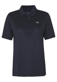 Polo di colore blu navy realizzato in cotone. Presenta un colletto classico, una chiusura con tre bottoni e un piccolo logo verde ricamato sul petto.